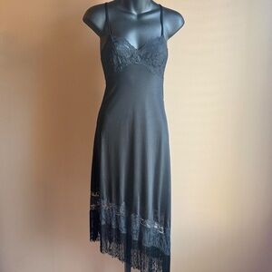 Black asymmetrical mini dress with fringe